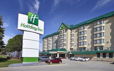 Hotel exterior and parking area at Holiday Inn Conference Center Edmonton South.