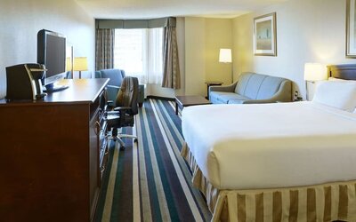 Bright day use room with living area and workspace at Holiday Inn Conference Center Edmonton South.