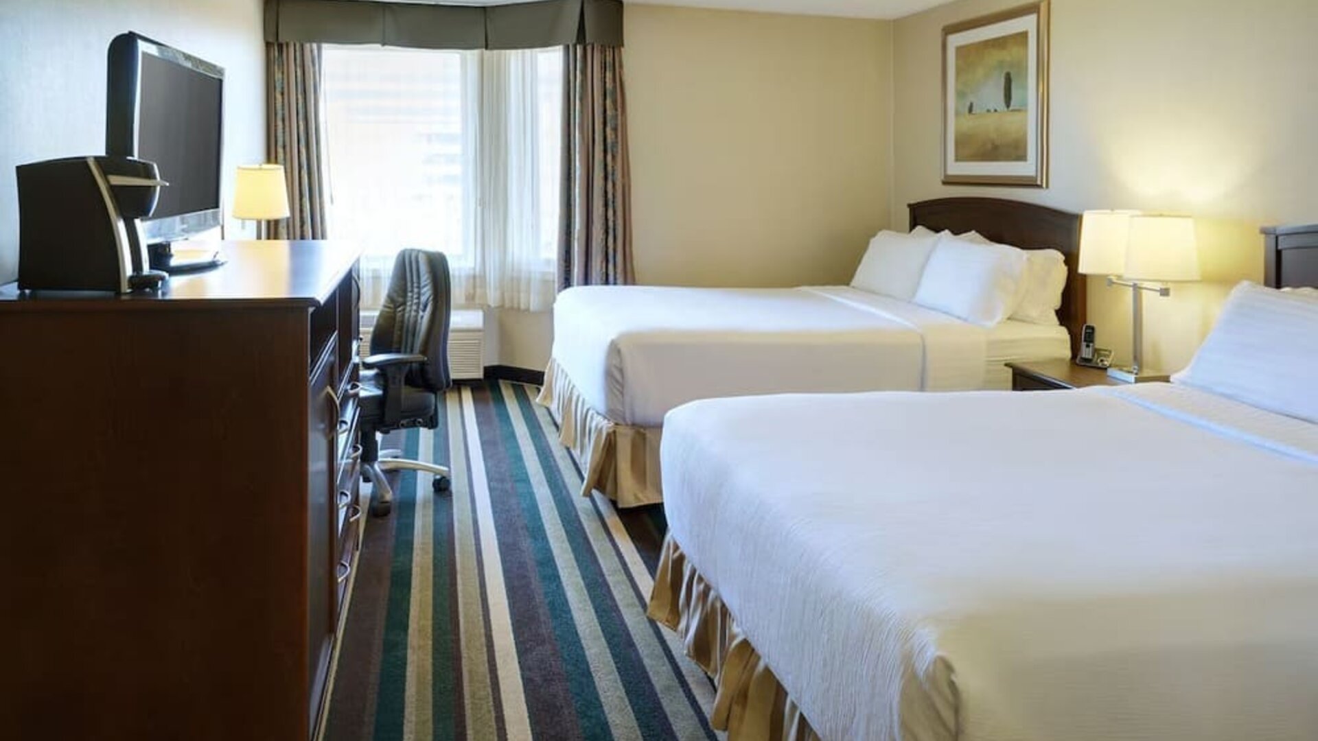 Bright and spacious day use twin room with work desk and private bathroom at Holiday Inn Conference Center Edmonton South.