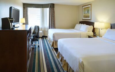 Bright and spacious day use twin room with work desk and private bathroom at Holiday Inn Conference Center Edmonton South.