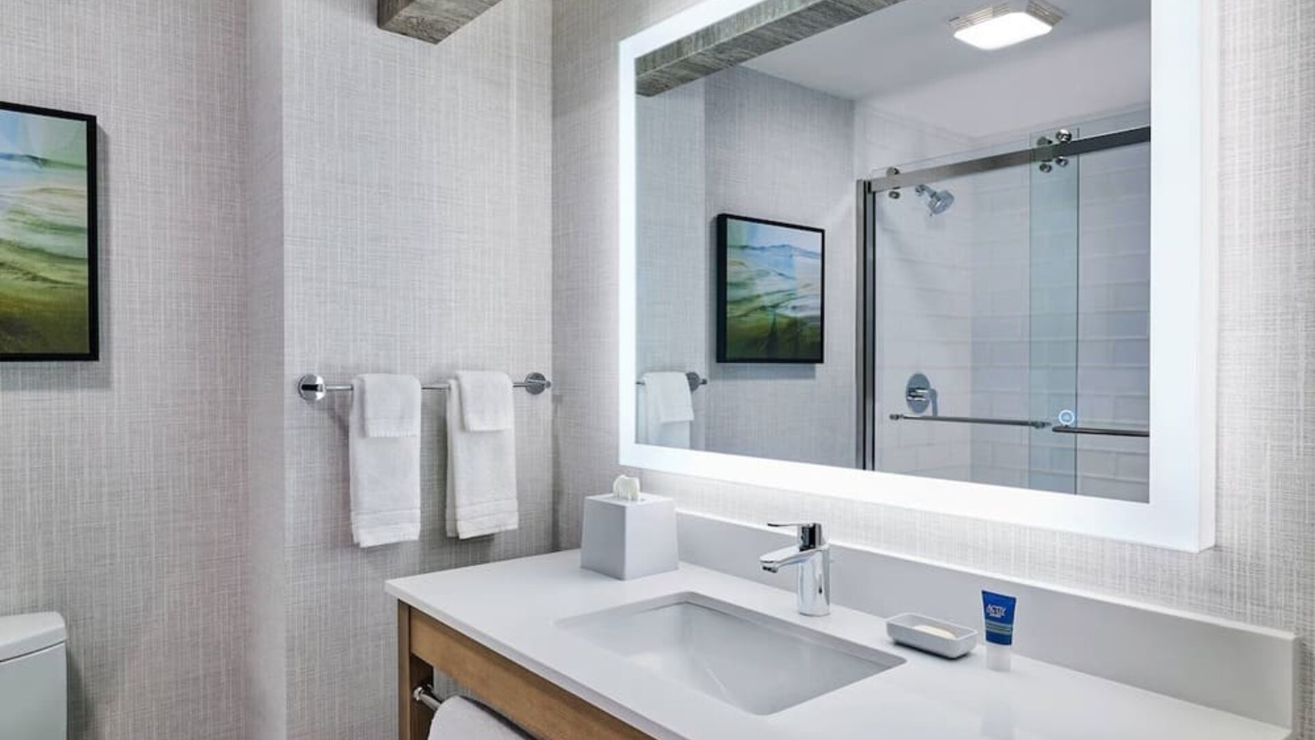 Guest bathroom with shower at Four Points By Sheraton Salt Lake City Airport.