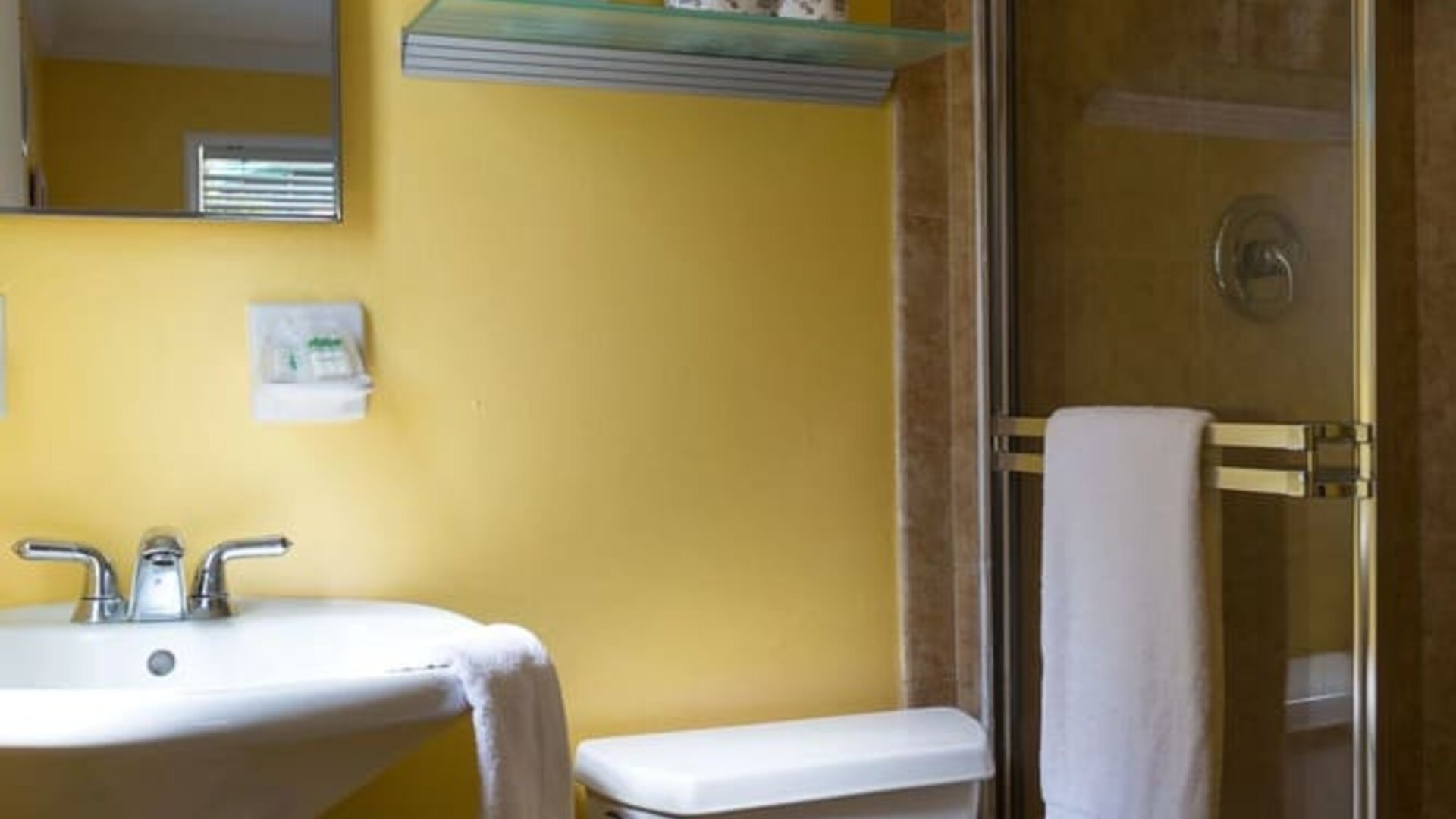 Guest bathroom with shower at Riptide Hotel.
