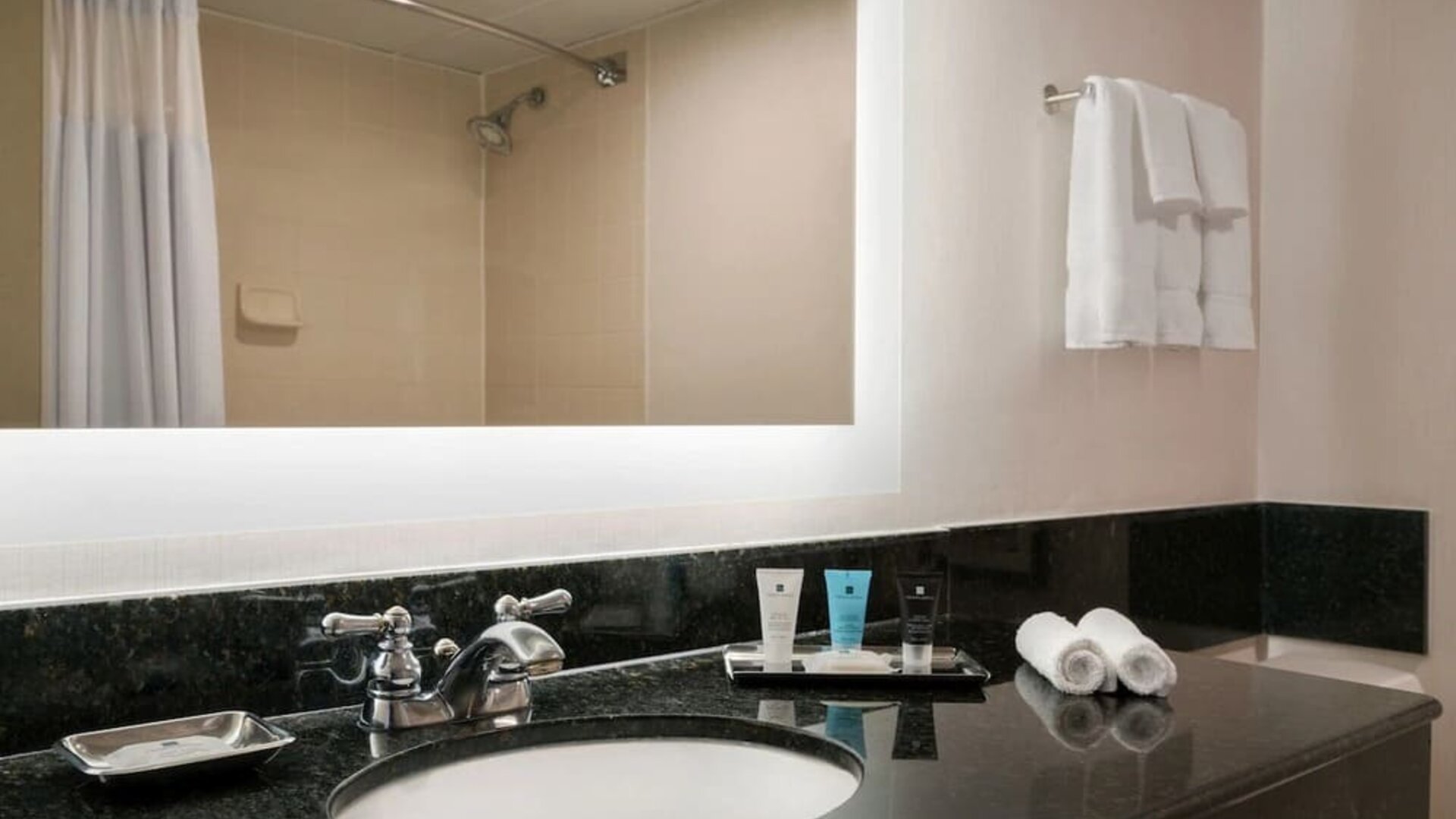 Guest bathroom with shower at Crowne Plaza Englewood.