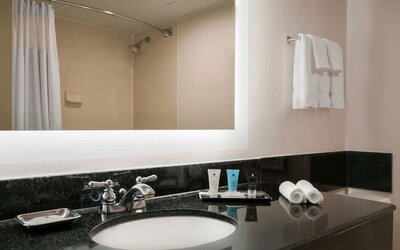 Guest bathroom with shower at Crowne Plaza Englewood.