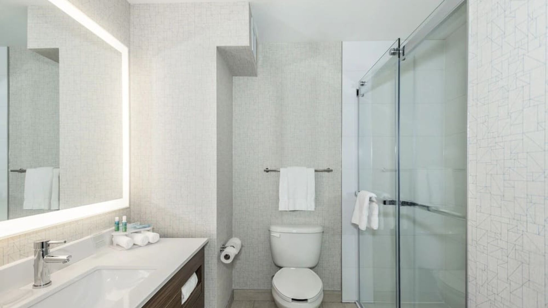 Guest bathroom with shower and free toiletries at Holiday Inn Express & Suites Medicine Hat.