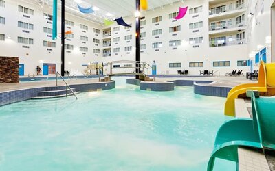 Indoor pool with water slides at Holiday Inn Lethbridge. 