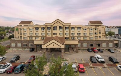 Hotel exterior with parking area at Holiday Inn Lethbridge. 