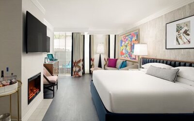 Day use room with balcony and sofa at Le Parc At Melrose.