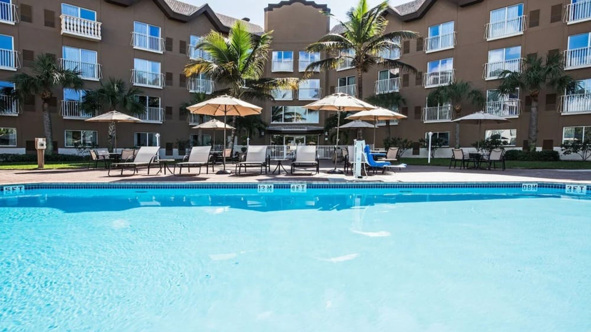 Refreshing outdoor pool at Holiday Inn Express & Suites Naples Downtown - 5th Avenue.