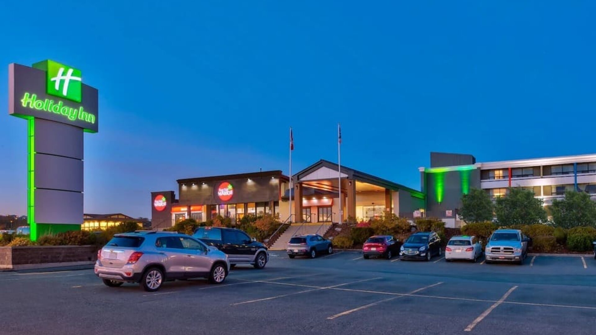 Hotel exterior and parking area at Holiday Inn St. John's Conference Centre.