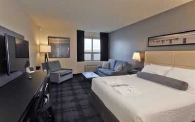 Day use room with living area and workspace at Rodd Miramichi River.