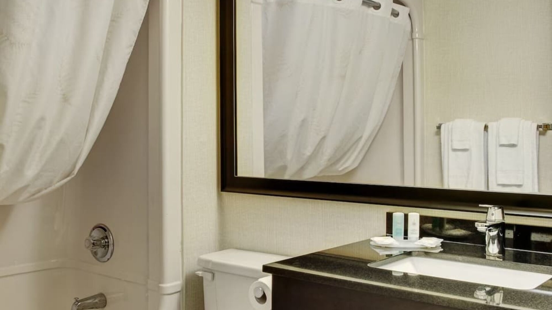 Guest bathroom with tub and free toiletries at Comfort Inn Pembroke.