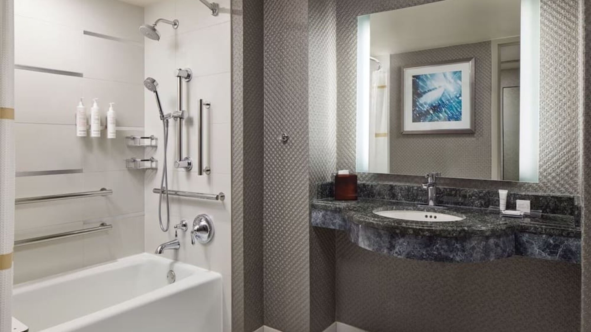 Guest bathroom with shower and tub at Crystal Gateway Marriott.