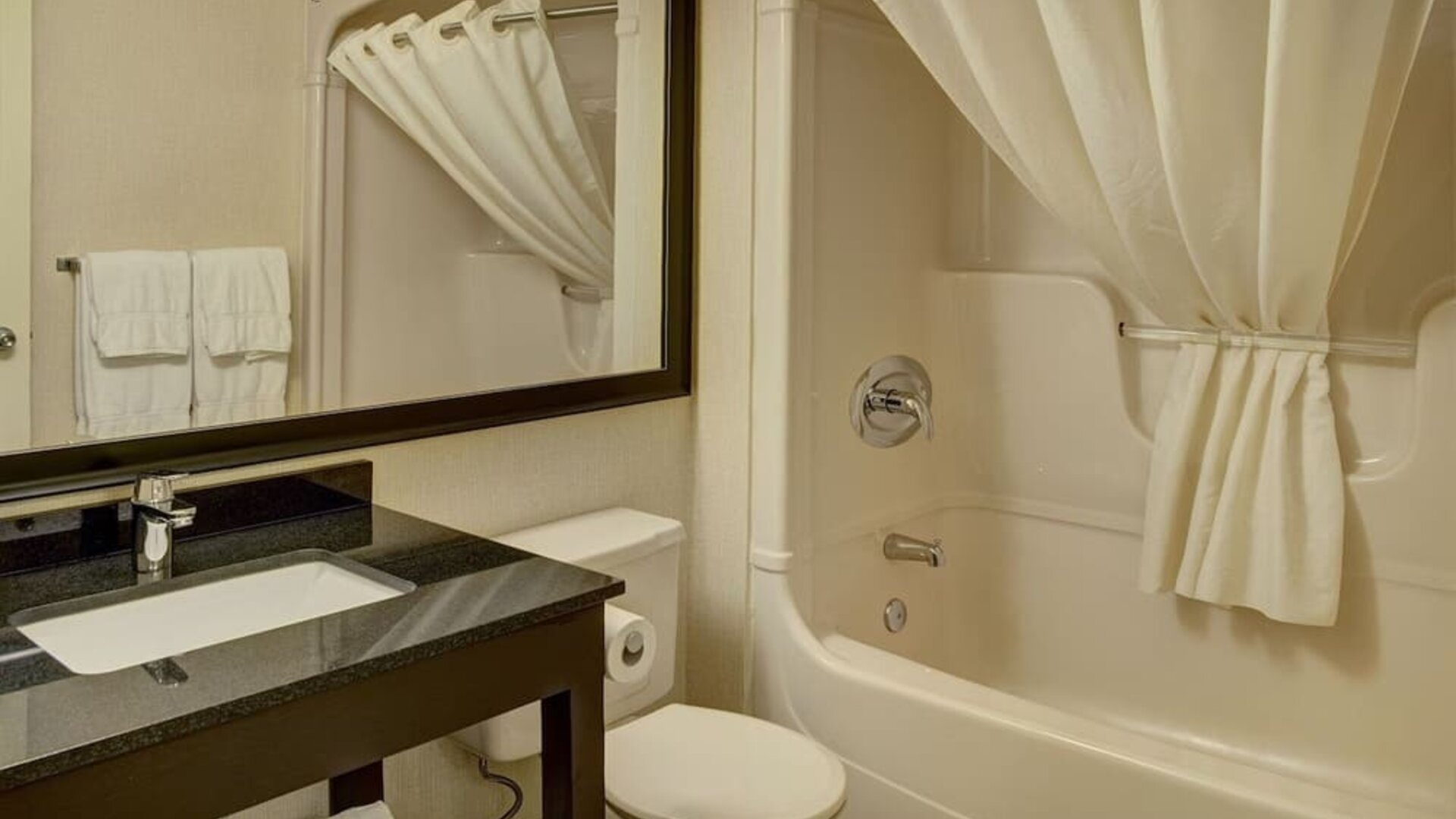 Guest bathroom with tub at Comfort Inn Belleville.