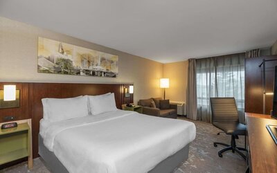 Standard day use room with work desk and sofa at Comfort Inn Fredericton.