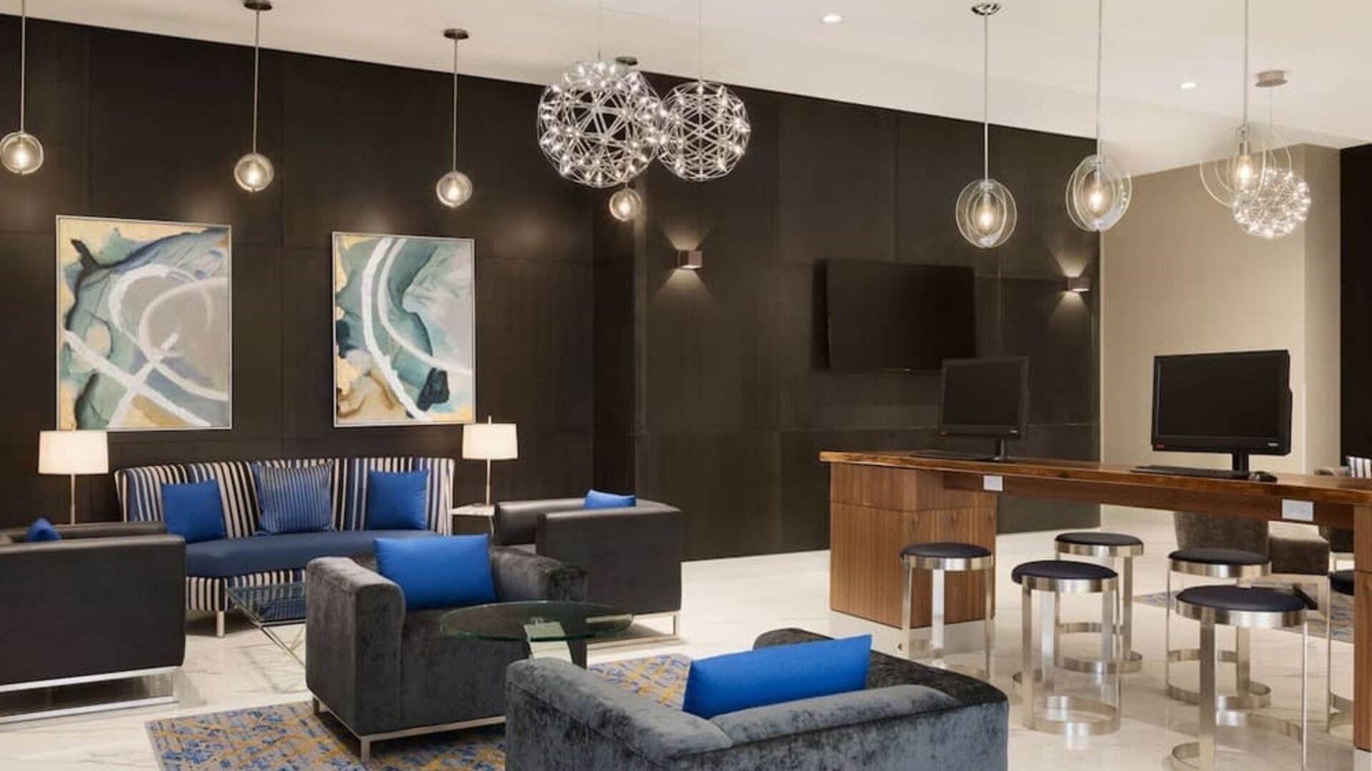 Business center and lounge area at Embassy Suites By Hilton Toronto Airport.