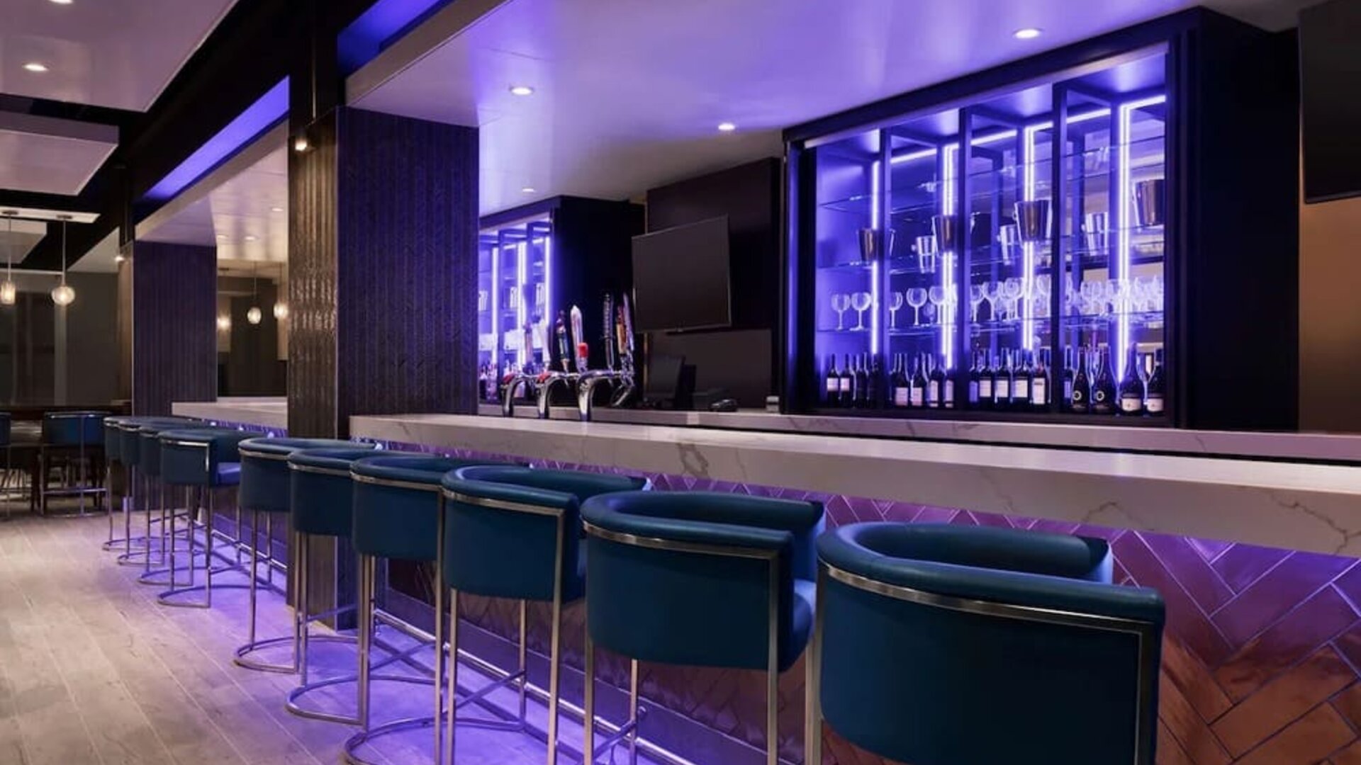 Hotel bar with lounge seating at Embassy Suites By Hilton Toronto Airport.