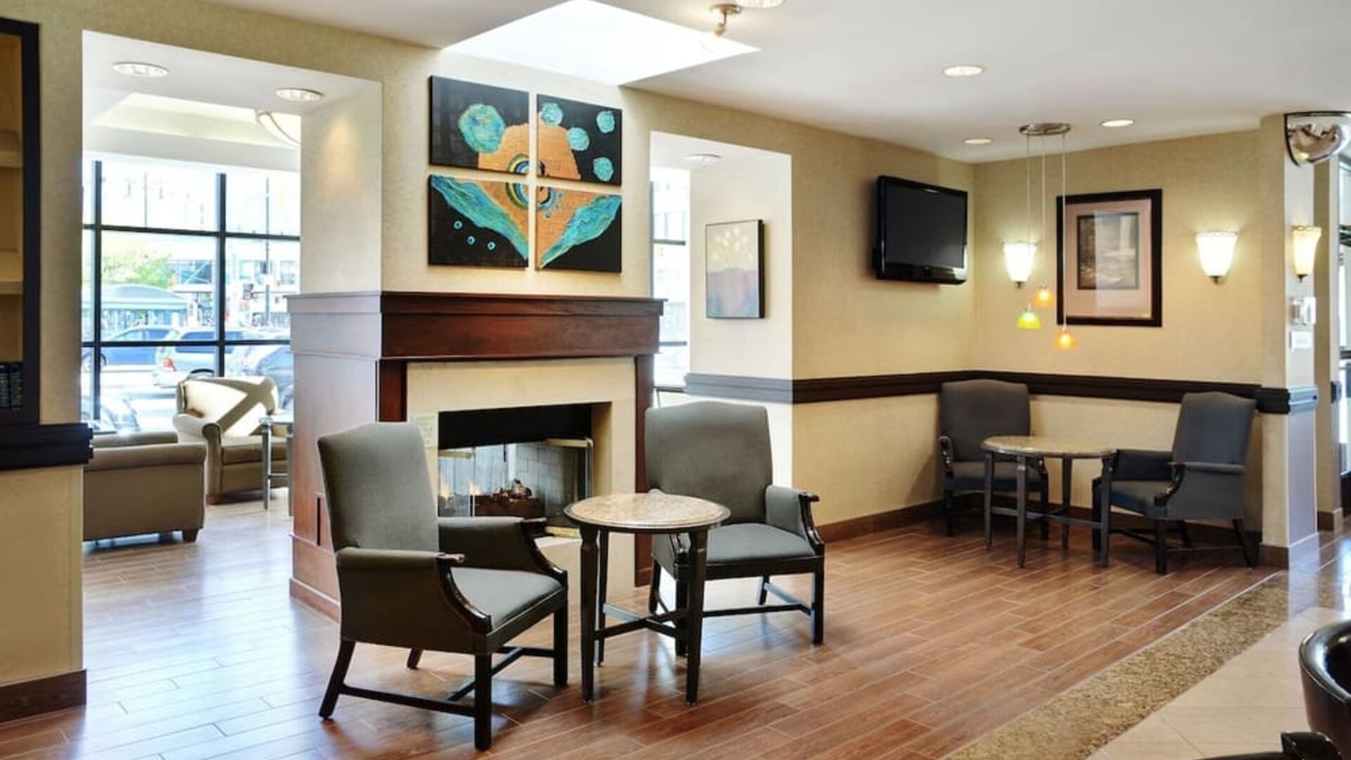 Lobby lounge with comfortable seating and fireplace at Holiday Inn Winnipeg Downtown.