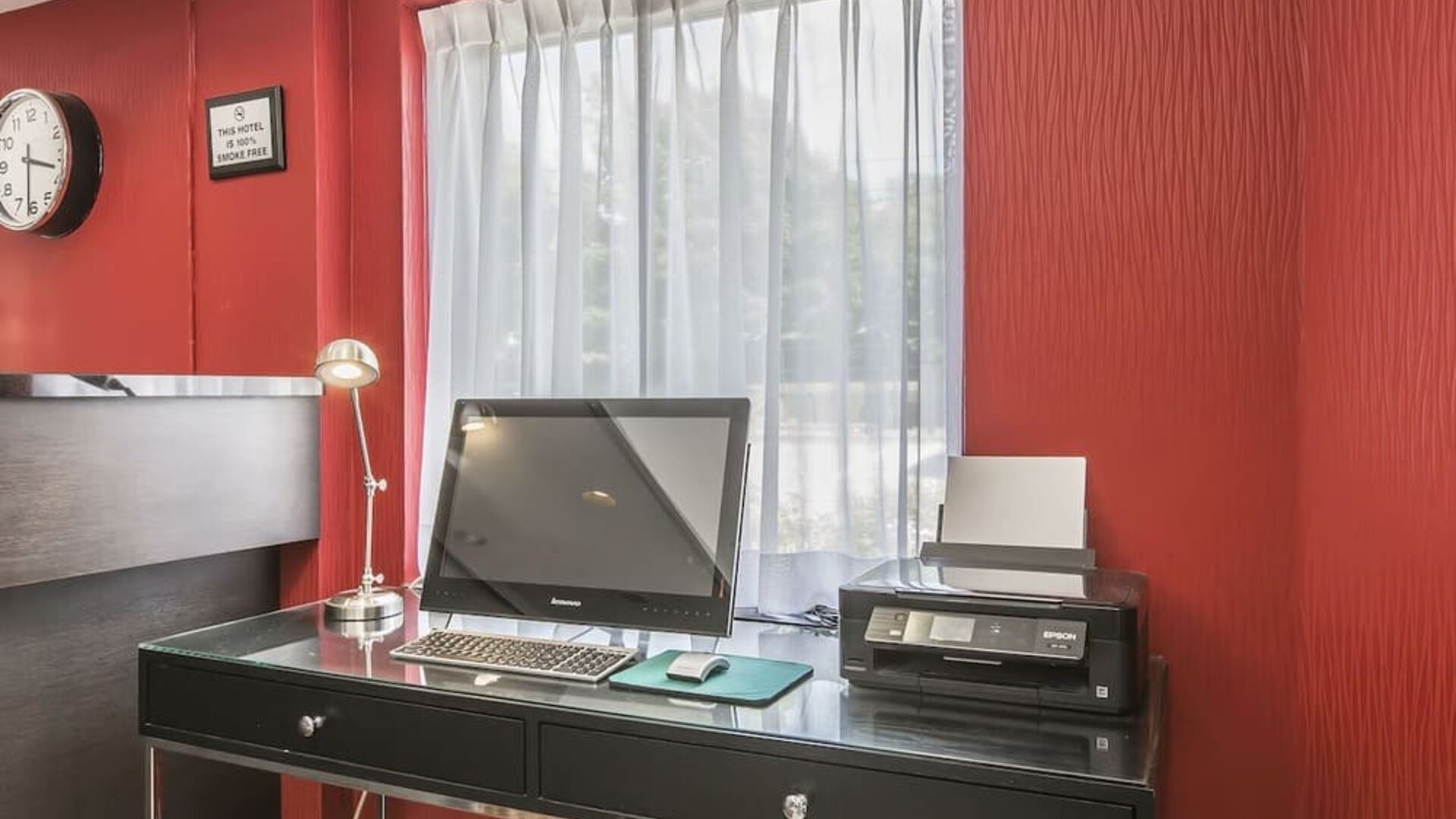 Business desk with computer and printer at Comfort Inn Sydney.