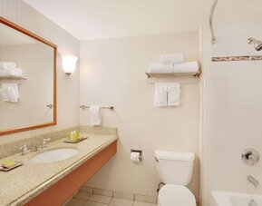 Guest bathroom with shower and tub at Hilton Seattle Airport & Conference Center.
