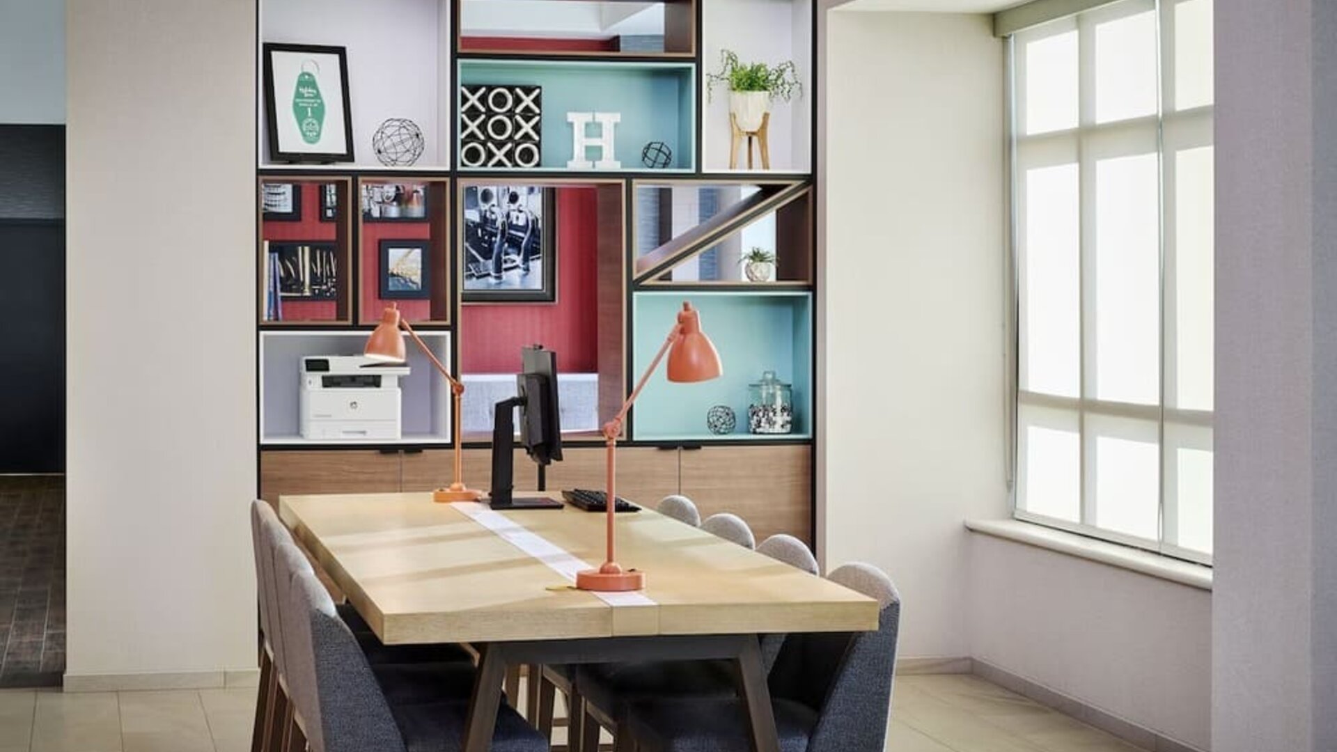 Business center with computer, printer and comfortable seating at Holiday Inn & Suites Oakville At Bronte.