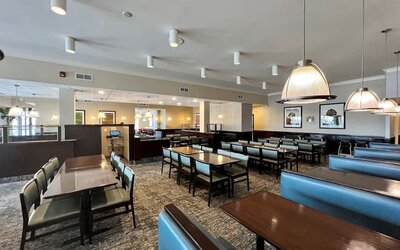 Dining area with comfortable seating at Holiday Inn Toronto Airport East.