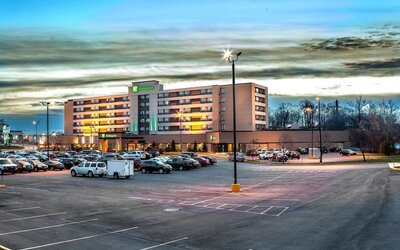 Hotel exterior and parking area at Holiday Inn Laval Montreal.