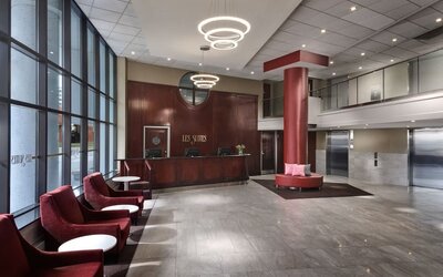 Lobby lounge with comfortable seating at Les Suites Hotel Ottawa.
