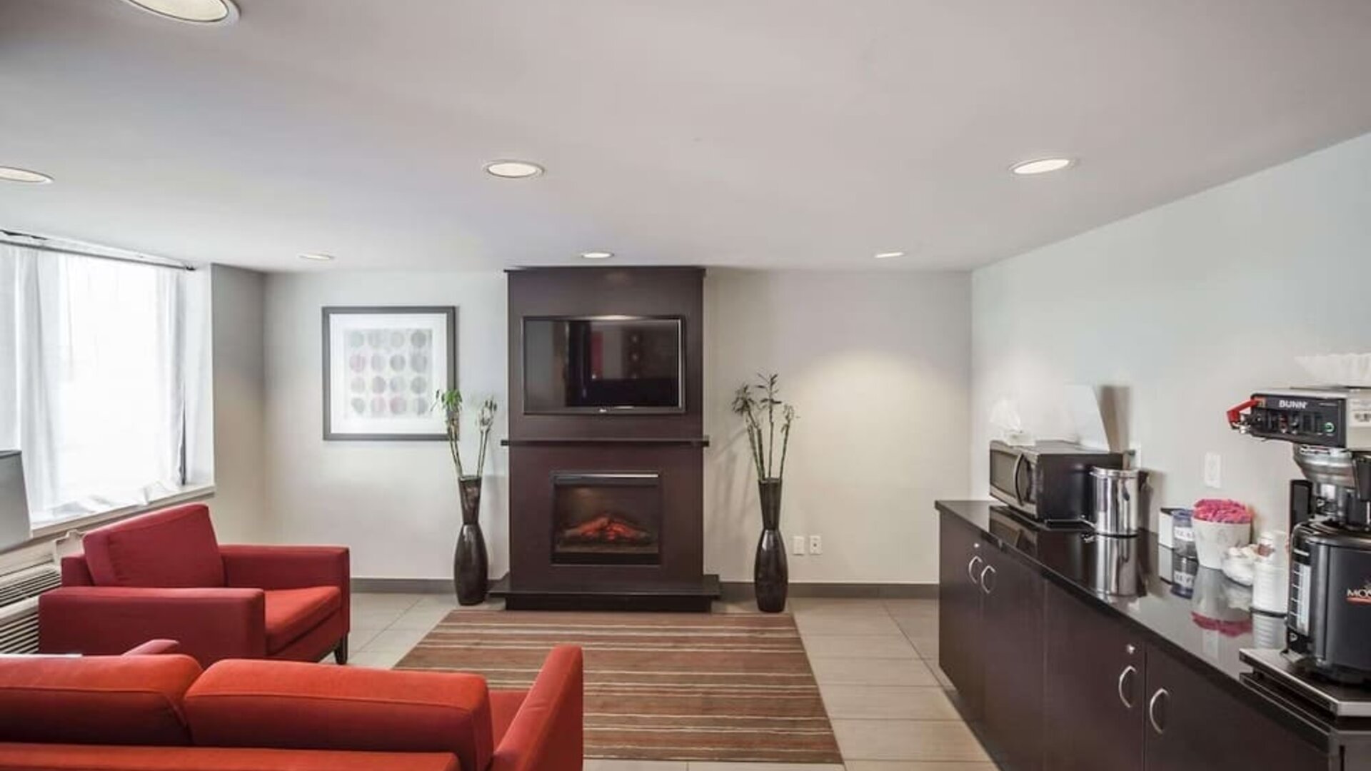 Lobby lounge with comfortable seating and fireplace at Comfort Inn Edmonton West.