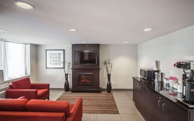 Lobby lounge with comfortable seating and fireplace at Comfort Inn Edmonton West.