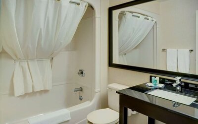 Guest bathroom with tub and free toiletries at Comfort Inn Edmonton West.