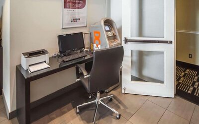 Business center with computer, printer, ergonomic chair and ATM at Comfort Inn Edmonton West.