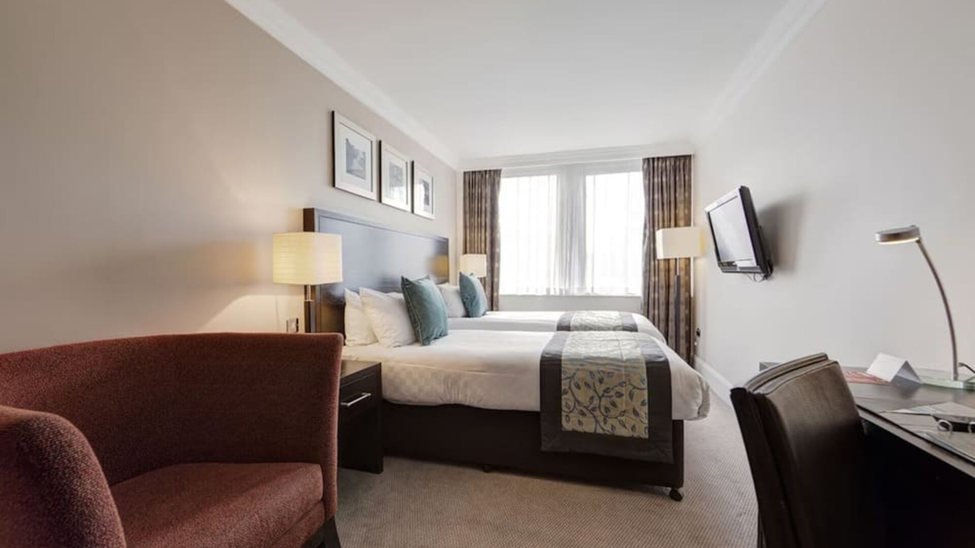 Day use twin room with work desk and sofa at Thistle Royal Trafalgar Square.
