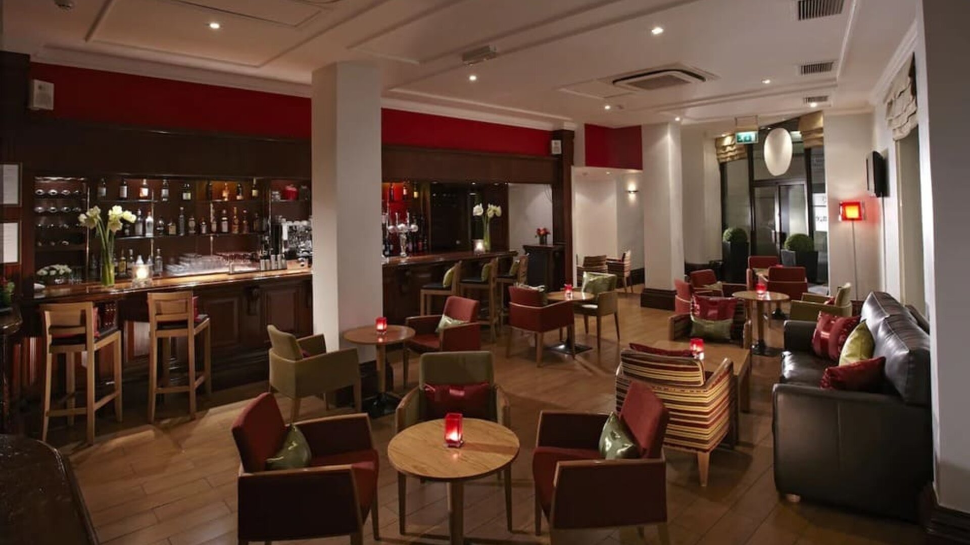Hotel bar with lounge seating at Thistle Royal Trafalgar Square.