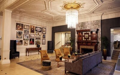 Lobby lounge with fireplace at The Royal Horseguards Hotel.