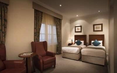 Day use twin room with lounge area at The Royal Horseguards Hotel.