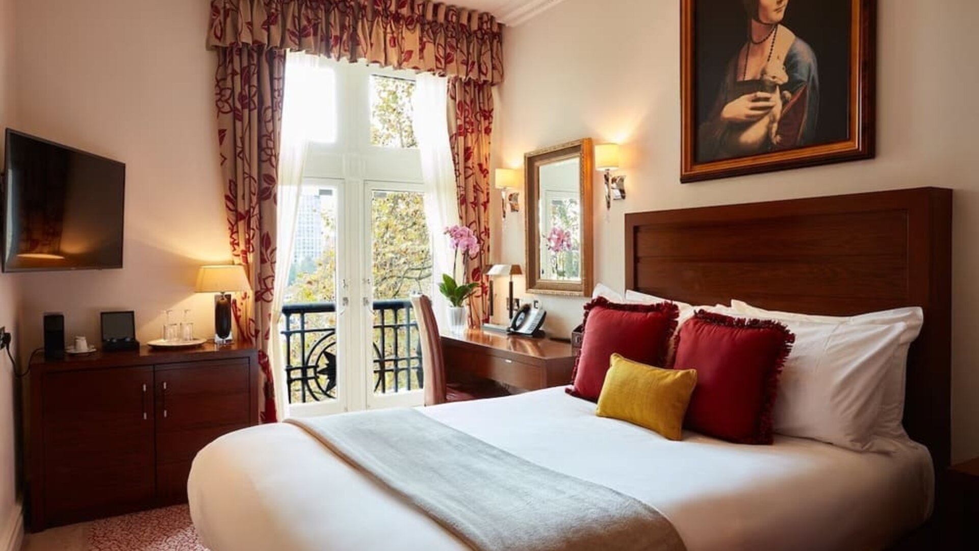 Day room with work desk and TV at The Royal Horseguards Hotel.