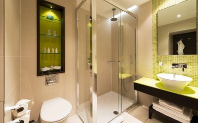 Guest bathroom with shower at Hotel Indigo London Paddington,