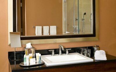 Guest bathroom with shower at The Bostonian Boston, A Millennium Hotel.