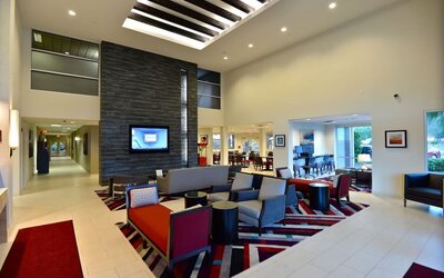 Lobby and coworking lounge at Hawthorn Suites By Wyndham El Paso Airport.