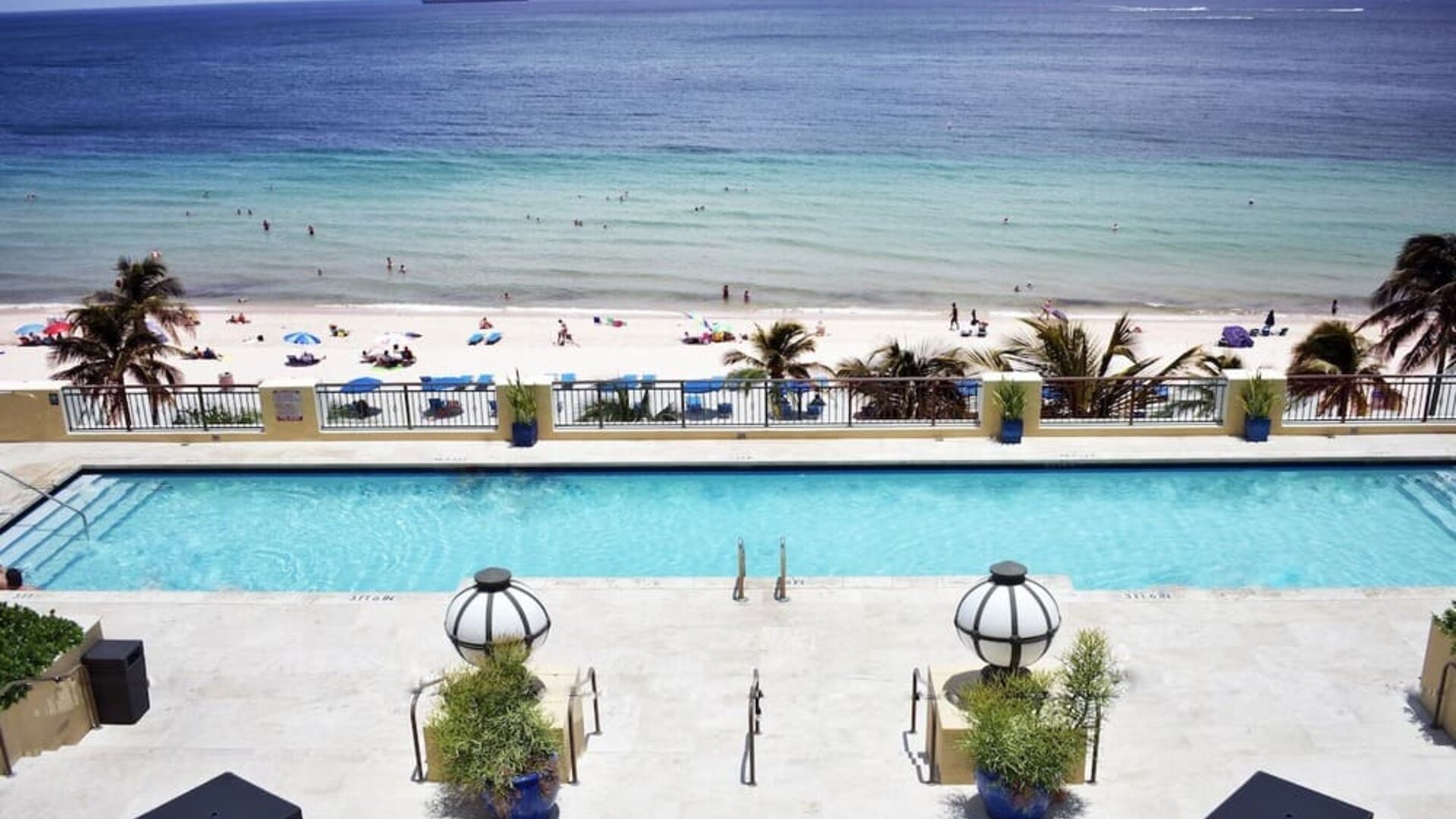 Refreshing outdoor pool with ocean view at The Atlantic Hotel & Spa.
