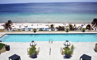Refreshing outdoor pool with ocean view at The Atlantic Hotel & Spa.
