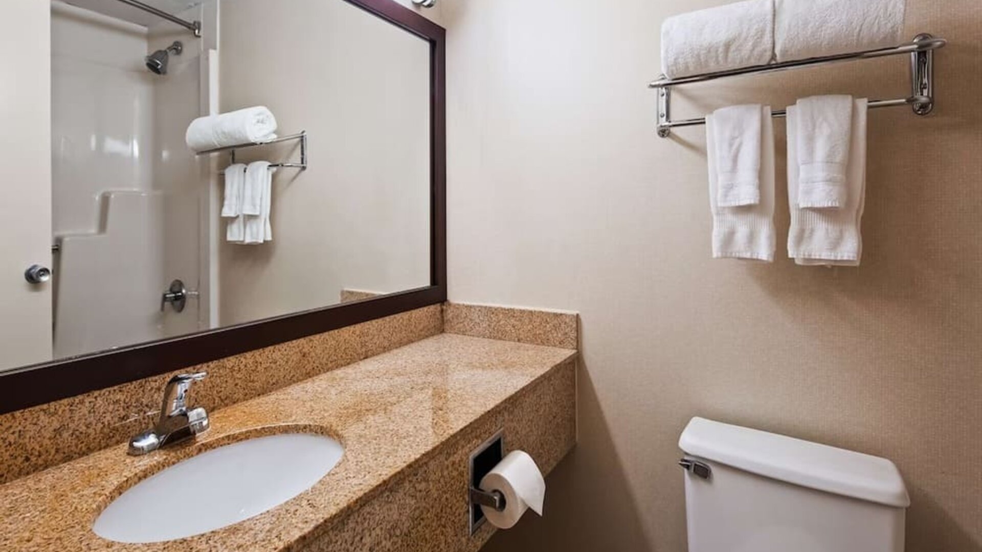 Guest bathroom with shower at Best Western Executive Hotel Of New Haven-West Haven.