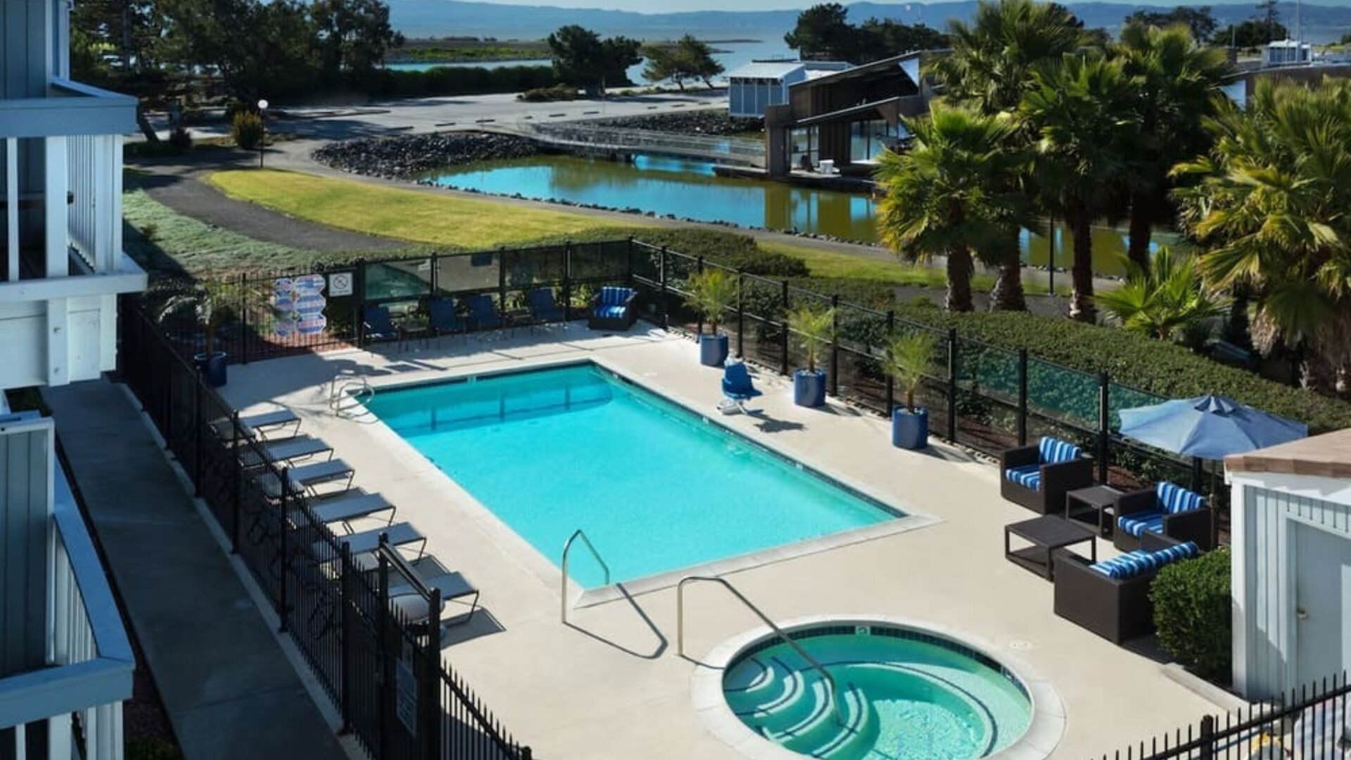 Refreshing outdoor pool and spa tub at The Marina Inn On San Francisco Bay.