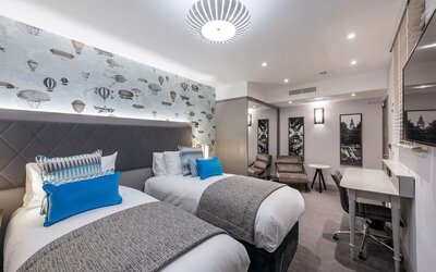 Day use twin room with work desk and lounge area at Mercure Hotel London Hyde Park.