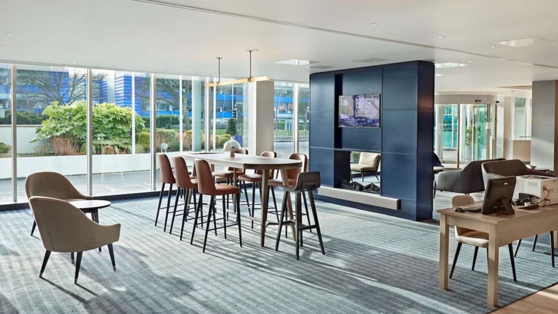 Lobby workspace at Hyatt Place London Heathrow Airport.