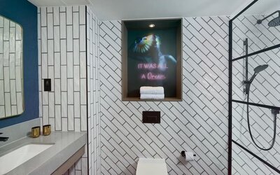 Guest bathroom with shower at NYX Hotel London Holborn By Leonardo.