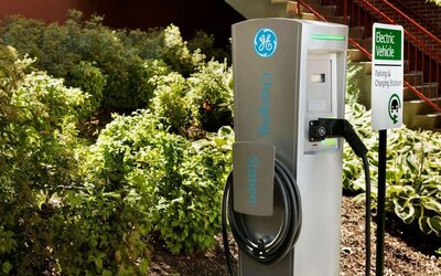 Car charging station and parking at Hampton Inn New York - LaGuardia Airport.