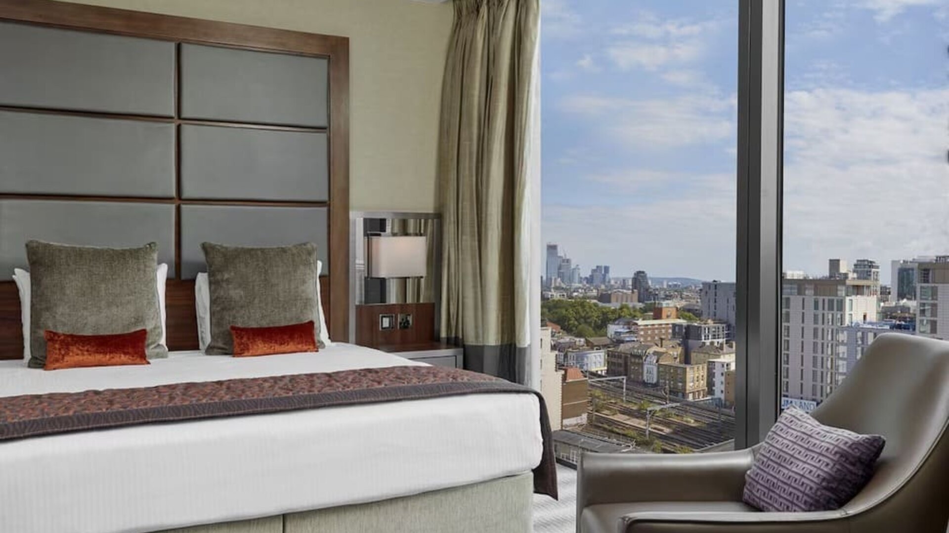 Day use room with floor to ceiling window at Leonardo Royal Hotel London Tower Bridge.