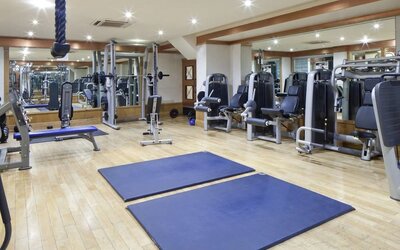 Fully equipped fitness center at Leonardo Royal Hotel London City.